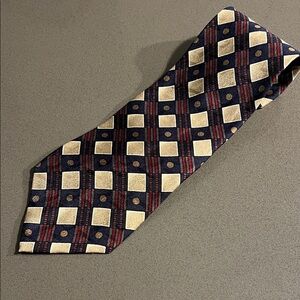 Givenchy 100% silk tie multicolored with blue/gold/maroon pattern.